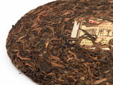 Sheng Pu Erh Qiao Mu Wang, fabryka Mengku, AA, 2011